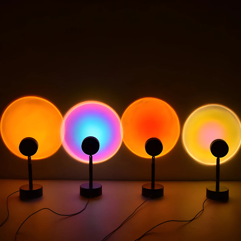 WiFi LED sunset projector light with 16 RGB colours, 360° rotation, glass lampshade, and touch switch on a table
