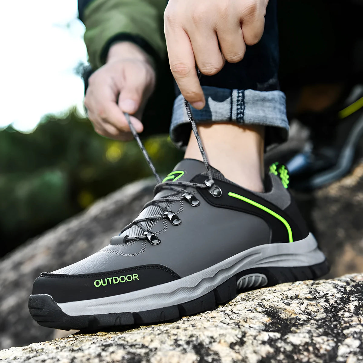 Men's black hiking shoes with synthetic leather upper and non-slip TPR outsole on outdoor trail