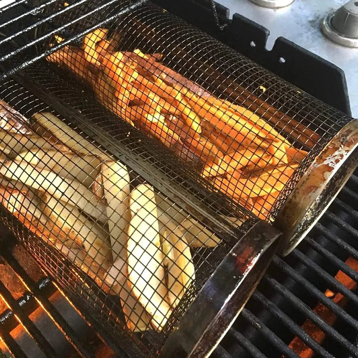 Rolling grill basket iron wire mesh 20x10x10cm with hook, filled with vegetables on a barbecue