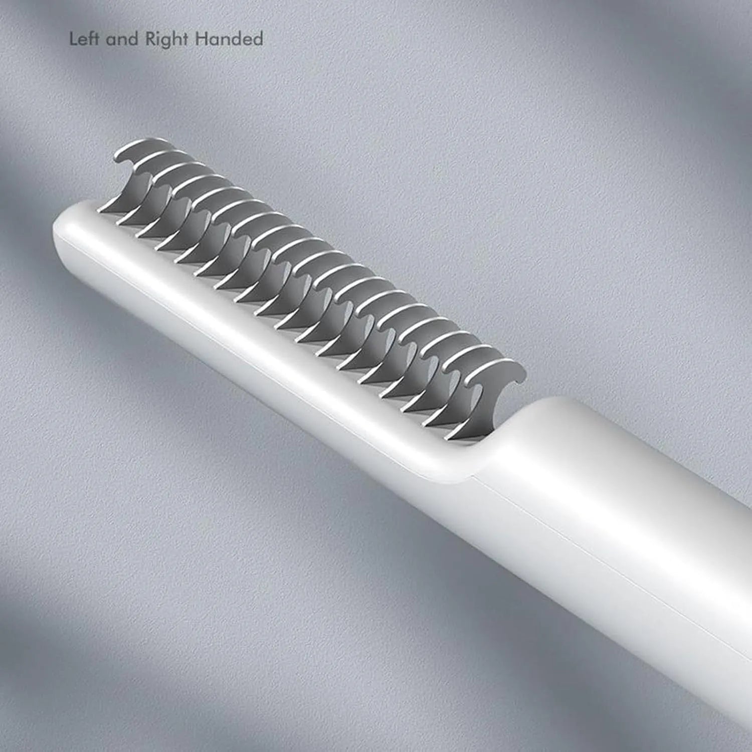Stainless steel dematting comb with ergonomic handle for removing knots from dog or cat hair.