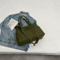 Large capacity polyester canvas shoulder tote bag in a solid colour, showing outer sandwich pocket.