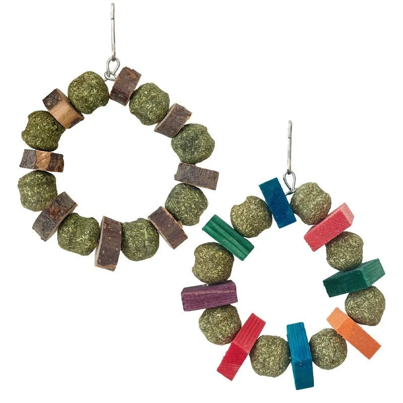 Hamster chew toy featuring applewood sticks and decorative straw balls with colourful sequins