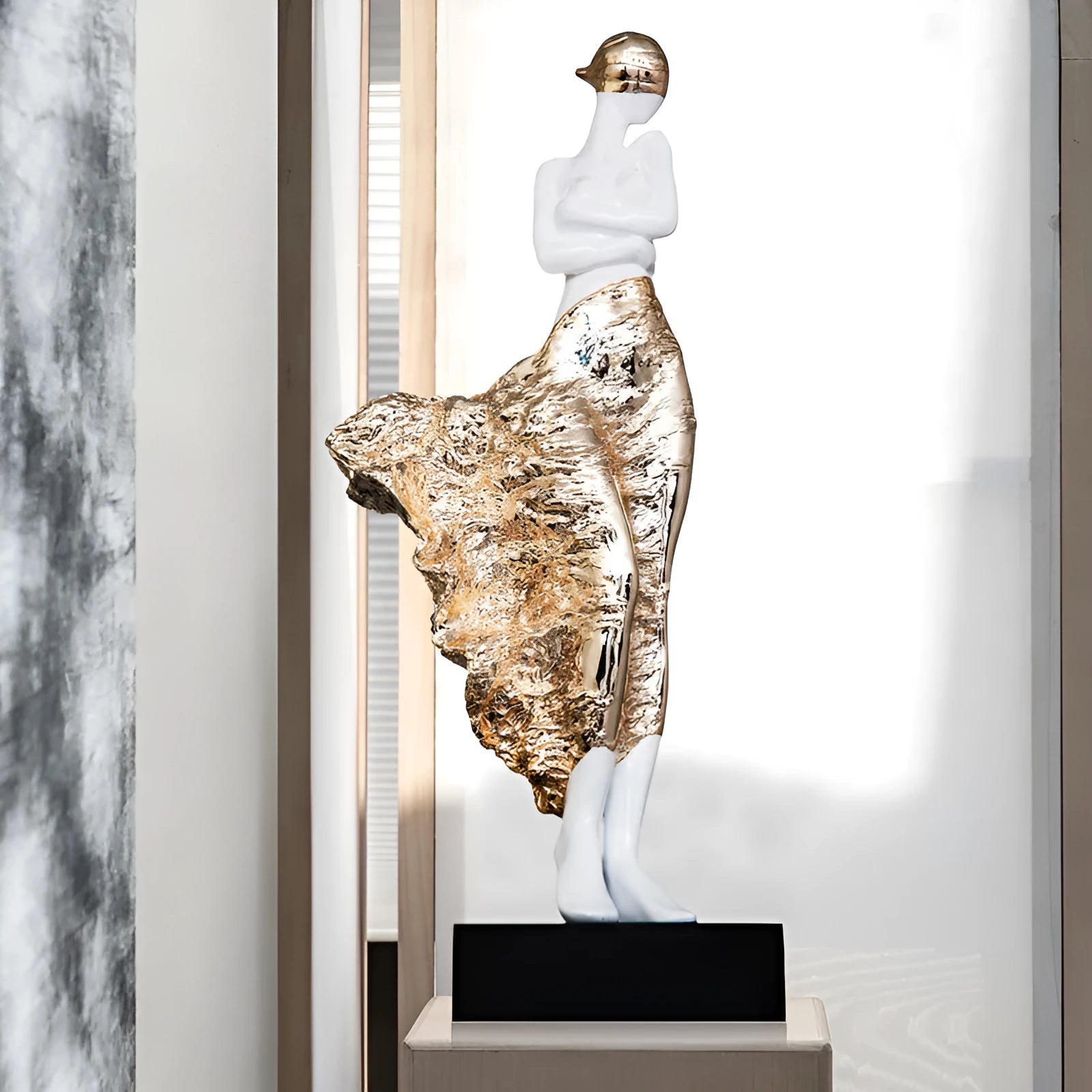 Modern sculptured resin ornament in rose gold or silver, 48cm high.