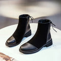Black women's knee-high Martin boots with side zipper, round toe, and decorative bow.
