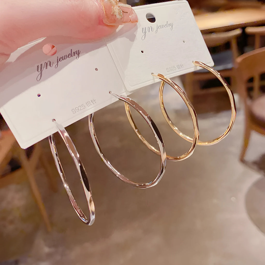 Silver needle exaggerated big hoop earrings in golden big circle with real gold plating on copper base