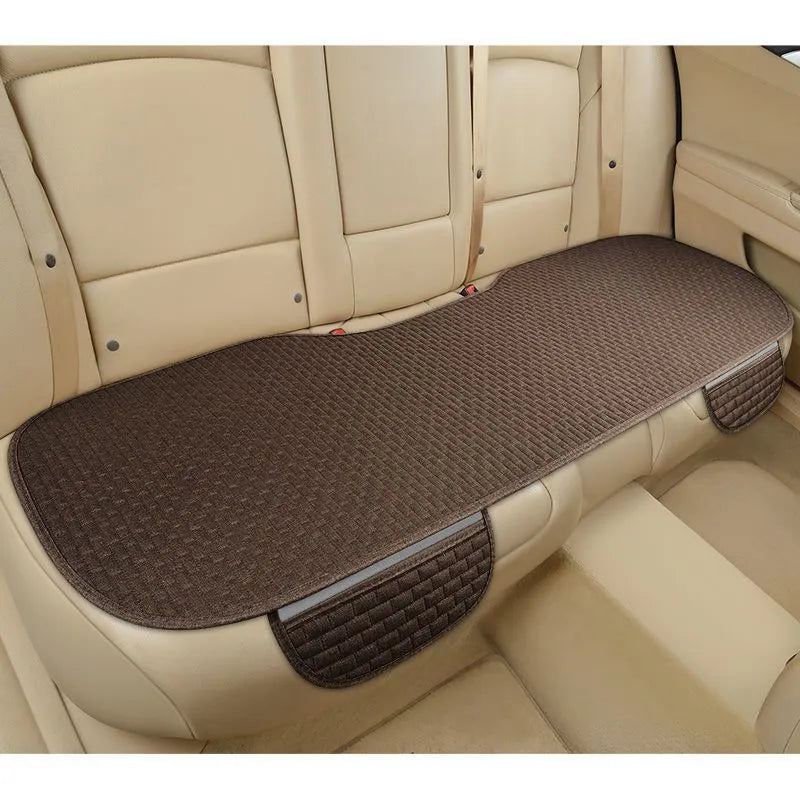 Linen car seat cushion with hemmed edge in charm coffee colour, shown on a car seat.