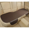 Linen car seat cushion with hemmed edge in charm coffee colour, shown on a car seat.