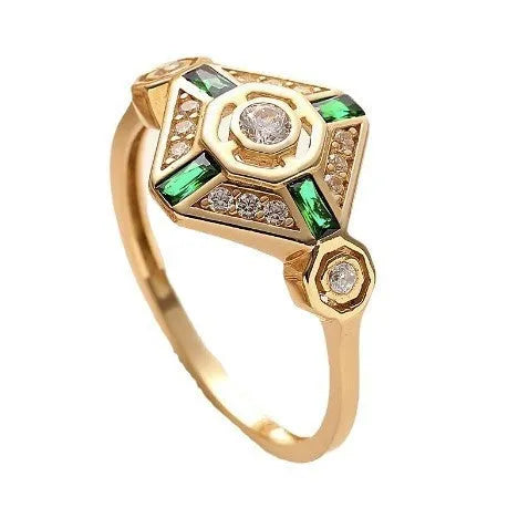 Square-shaped gold tone ring with emerald diamond colour on a model finger.