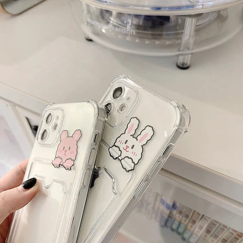 Cartoon design transparent TPU phone case with integrated card holder for Apple iPhone.