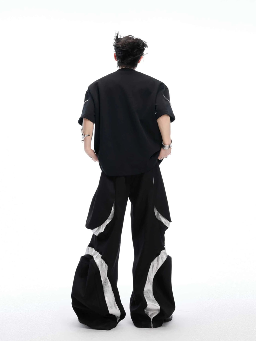 Black heavy cotton t-shirt with metal chain padded shoulder detail, round neck, short sleeves