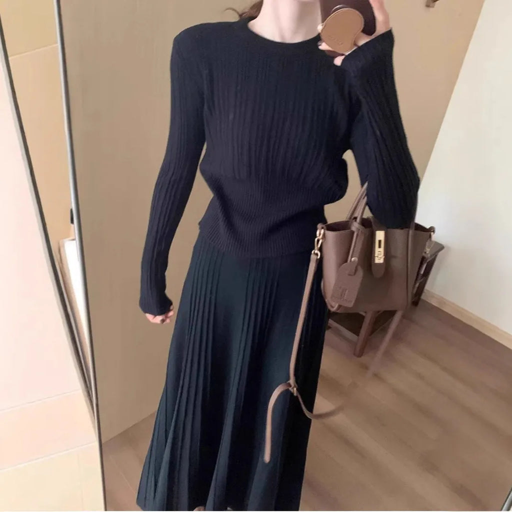 Dark grey knitted two-piece dress suit with 3D pattern, featuring a sweater and skirt in retro ethnic style.