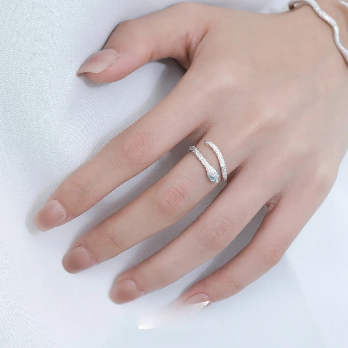 Adjustable silver-plated ring with snake design and zodiac motifs in platinum colour