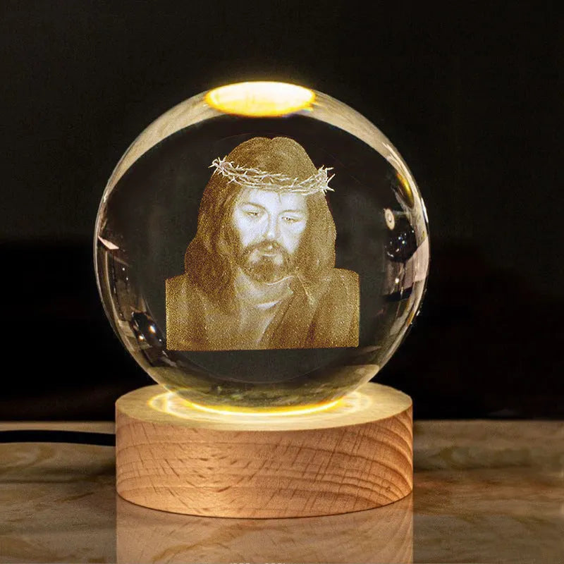 White crystal ball desk ornament with wood base and religious design inside