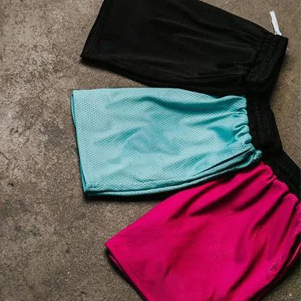 Man wearing black mesh quick-drying shorts for running or fitness training.