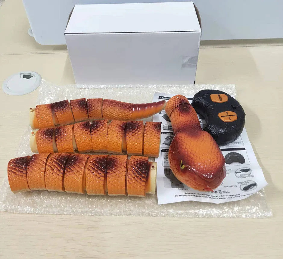 Smart sensing electronic snake cat toy with segmented plastic body and USB charging port