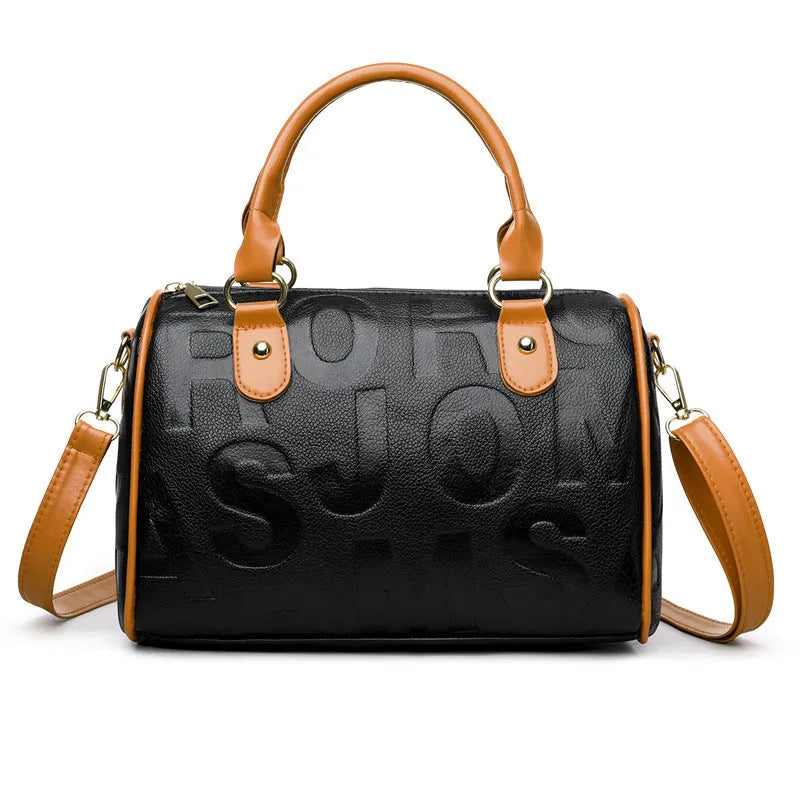 Brown cylindrical PU crossbody bag with a leather-like texture and three shoulder straps.