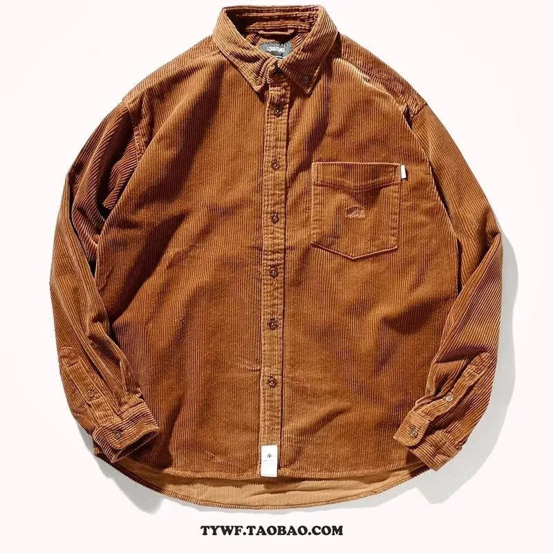 Man wearing a loose caramel coloured corduroy cardigan shirt in Hong Kong style.