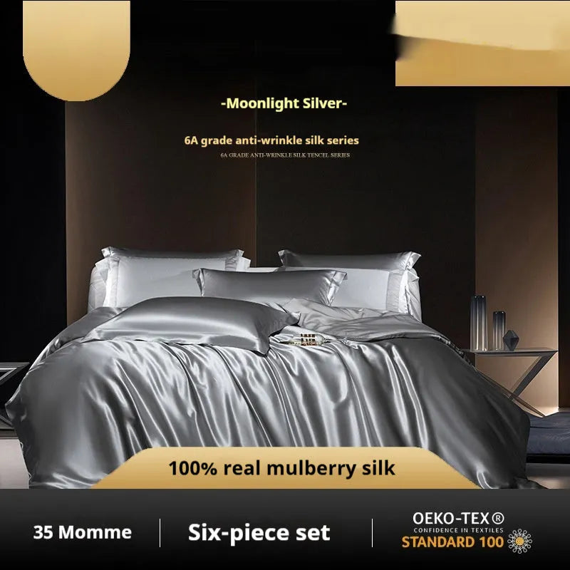 A silk four-piece quilt cover set in a solid colour, shown on a bed with matching sheets.