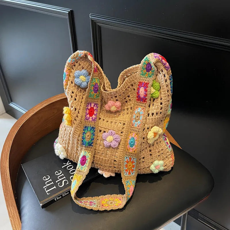 Woven beach shoulder bag with hollow weave pattern showing adjustable strap and interior