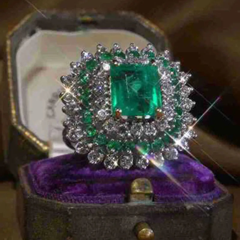 Emerald silver geometric metal ring ornament for women, shown on finger, size options available
