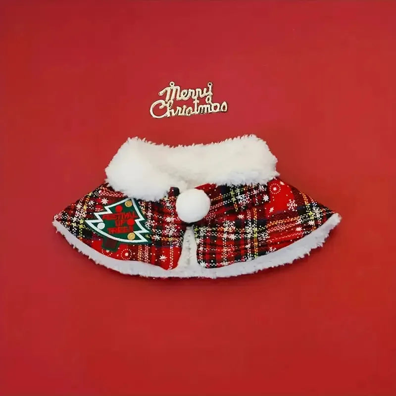 A red festive pet scarf with a bell pattern fastened around a dog's neck with an elastic collar.