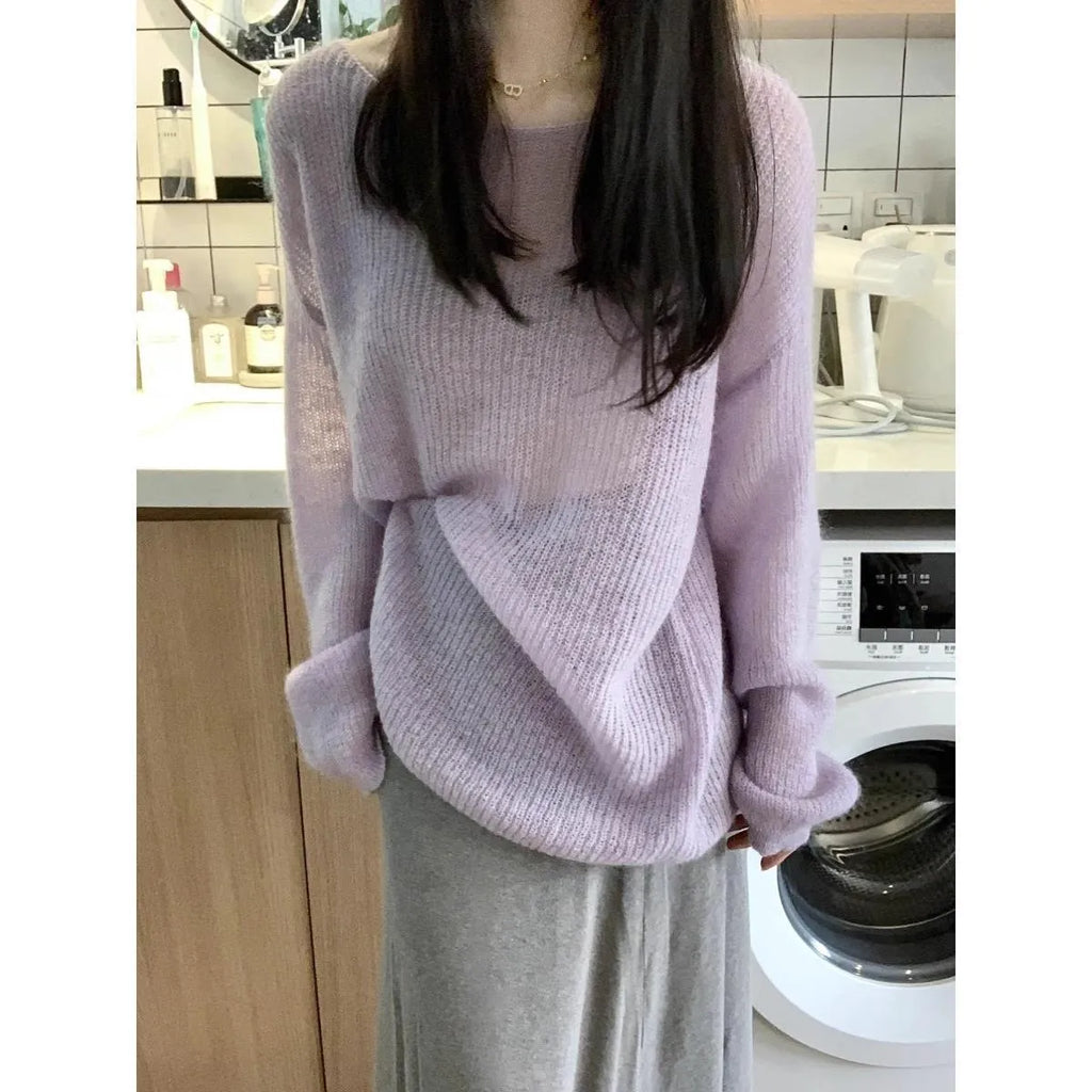 Purple women's blouse with hollow out design and princess sleeves on a hanger.