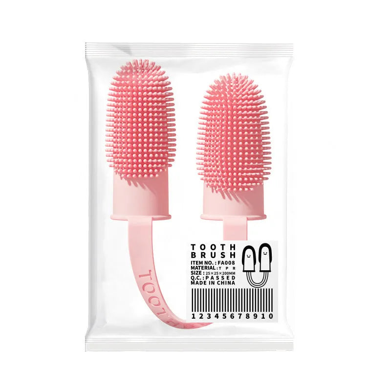 Close-up of blue green and pink silicone finger sleeves for pet dental cleaning on a hand.