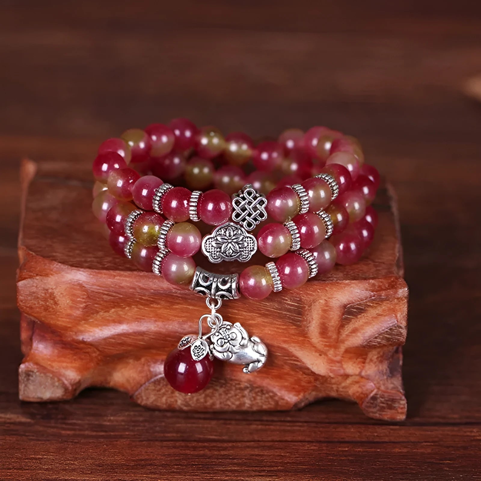 Watermelon crystal bracelet with Chinese knot closure and elephant bead design