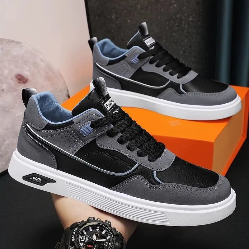 Men's low-top canvas board shoes in beige with leather stitching detail on a white background.