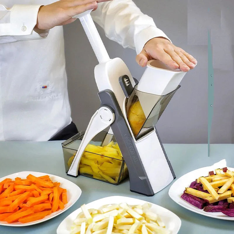 Multifunctional vegetable cutter in orange with adjustable slicing thickness and fold-down design, 32x12x6.3cm