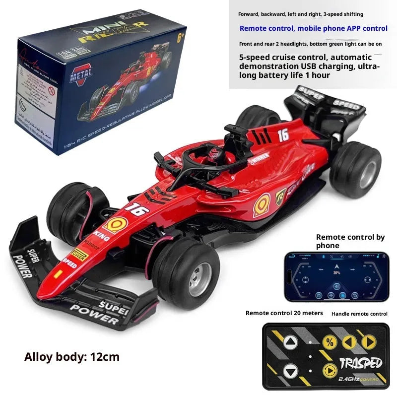 Red alloy mini remote controlled F1 racing car on a desk with 2.4GHz remote control