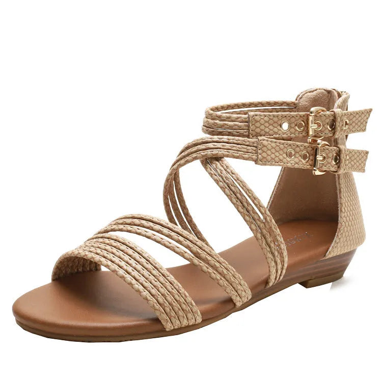 Women's black open toe Roman sandals with cross straps, a buckle, and a back zipper.