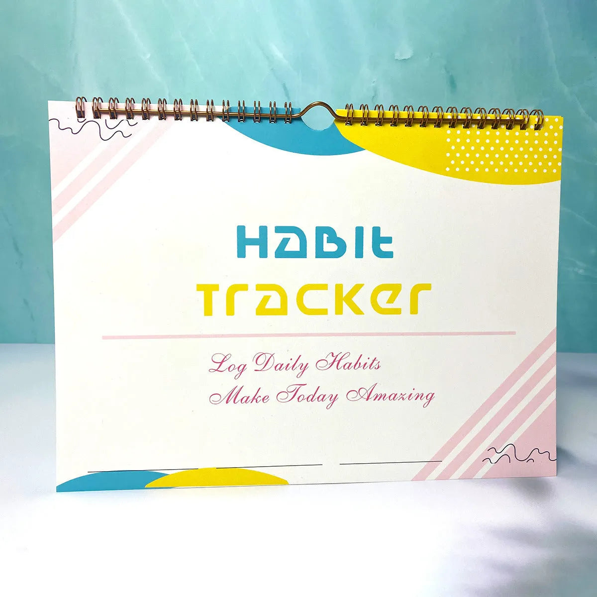 Habit tracking journal in four colour options showing 21cm × 28cm size