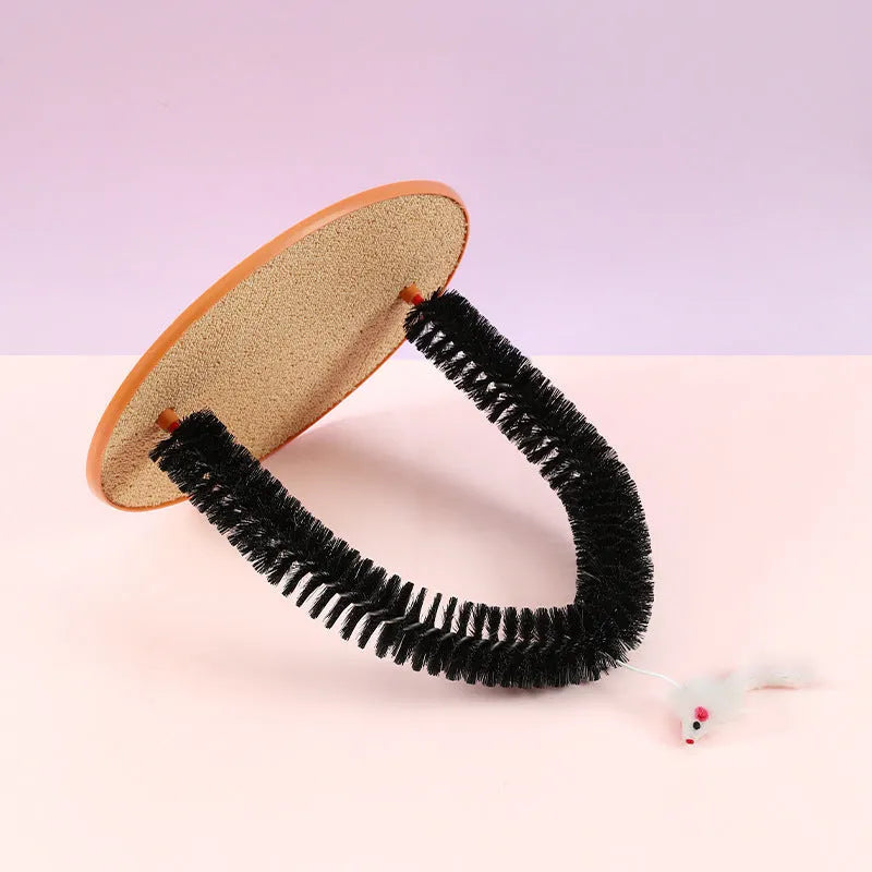 Black plastic arch-shaped cat grooming device with scratching cloth and attached mouse toy
