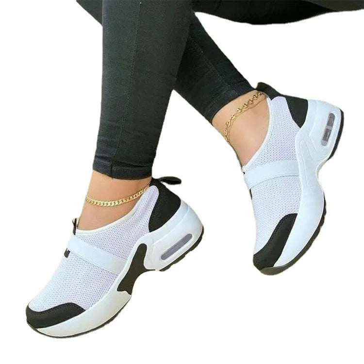 Women's lightweight mesh sneaker in multiple colours showing round toe and rubber sole.