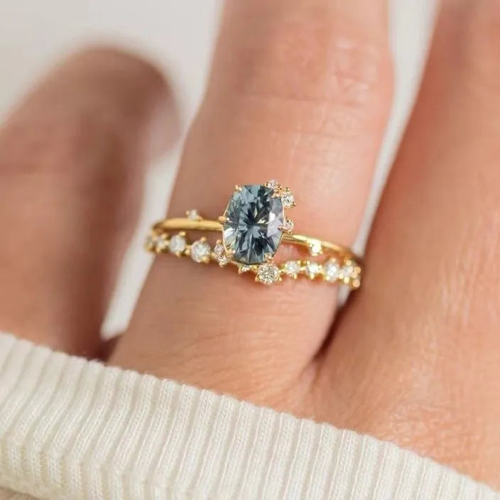 Gold plated floral shaped women's ring with green zircon stone details on alloy band