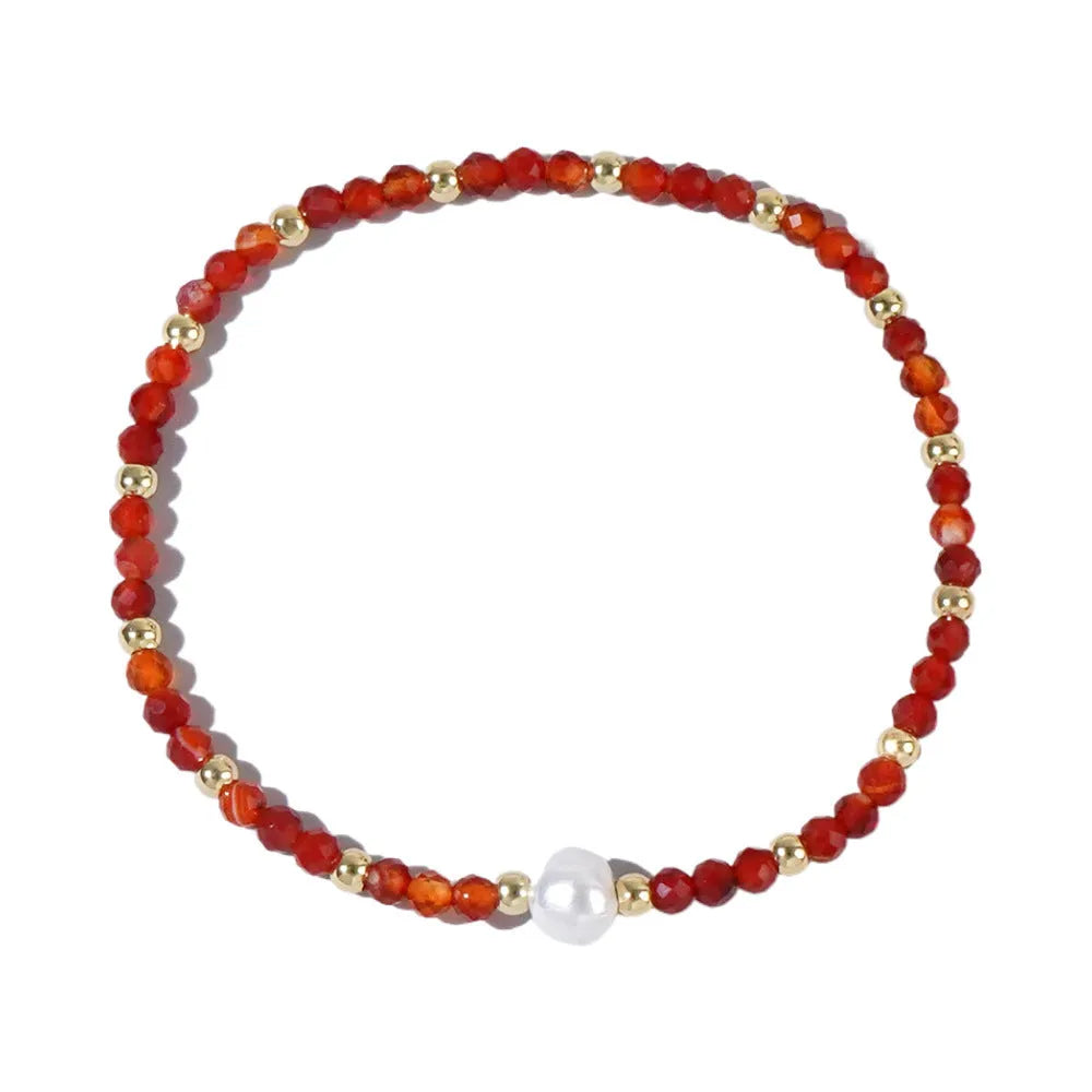 Close-up of a unisex natural stone bracelet with geometric ellipse beads on a wrist.
