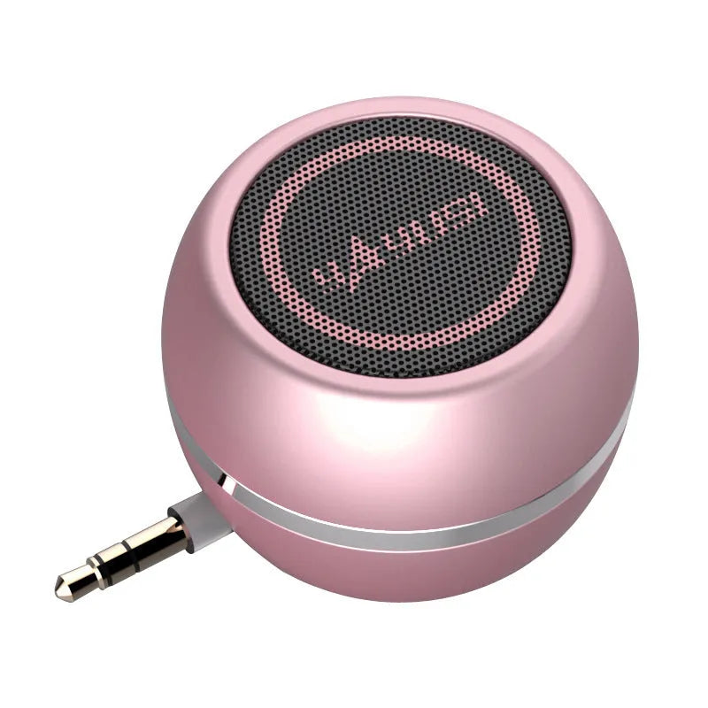 A5 portable mini speaker in red with 3.5mm audio plug and ABS plastic casing on a table