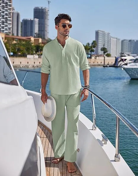 Men's solid colour cotton casual suit with long sleeves and trousers on a hanger.
