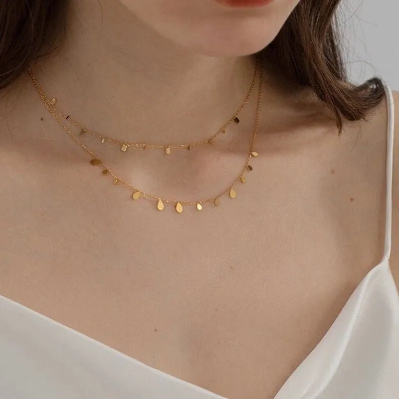 Titanium steel O-ring clavicle chain with drop pendant in 8169 White Diamond Water Drop colour, electroplated finish