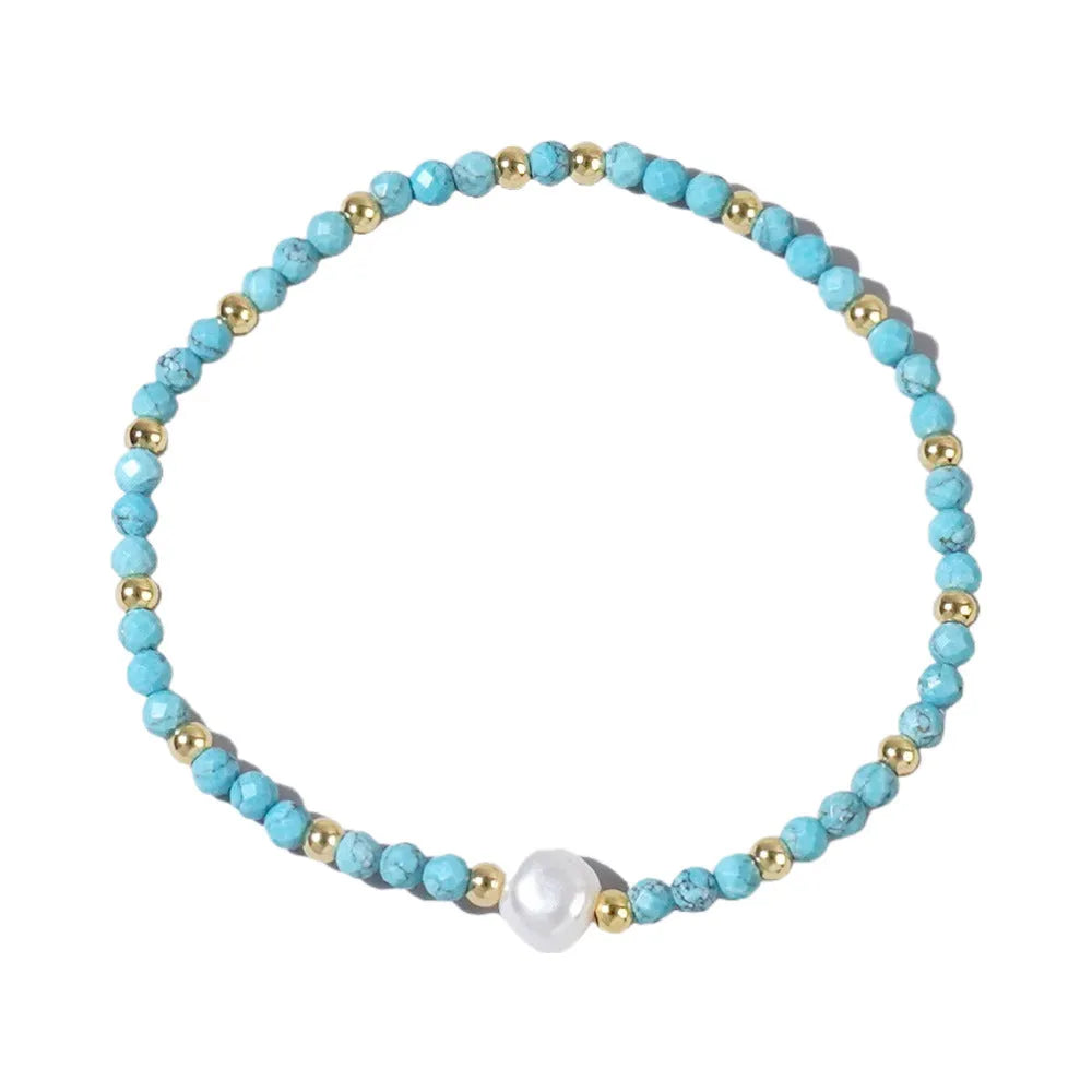 Close-up of a unisex natural stone bracelet with geometric ellipse beads on a wrist.