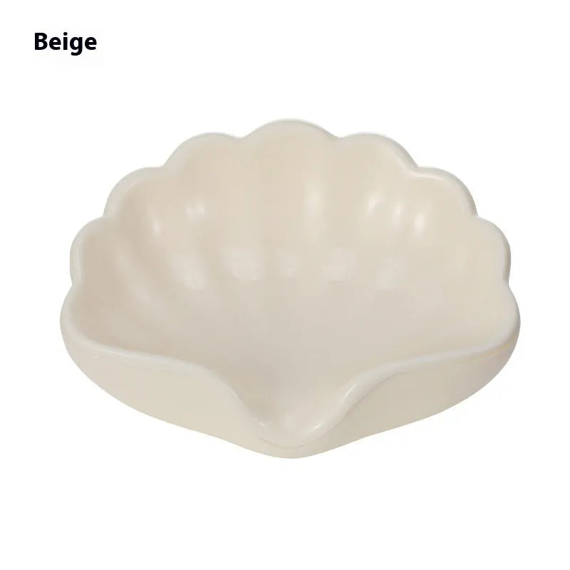Shell-shaped plastic soap dish in pearl white or cherry blossom pink for bathroom storage