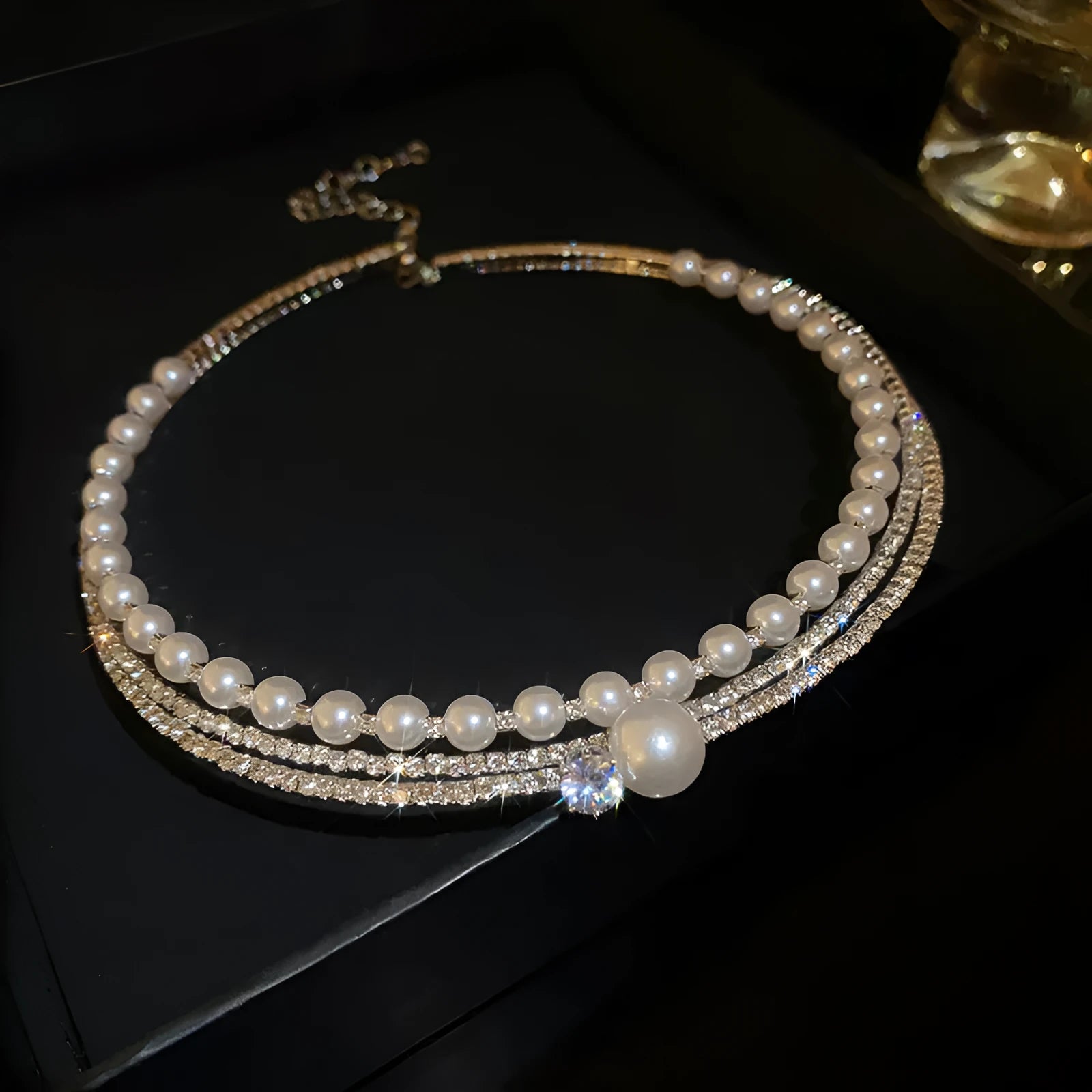 Silver curved round geometric alloy necklace designed to sit on the collarbone.