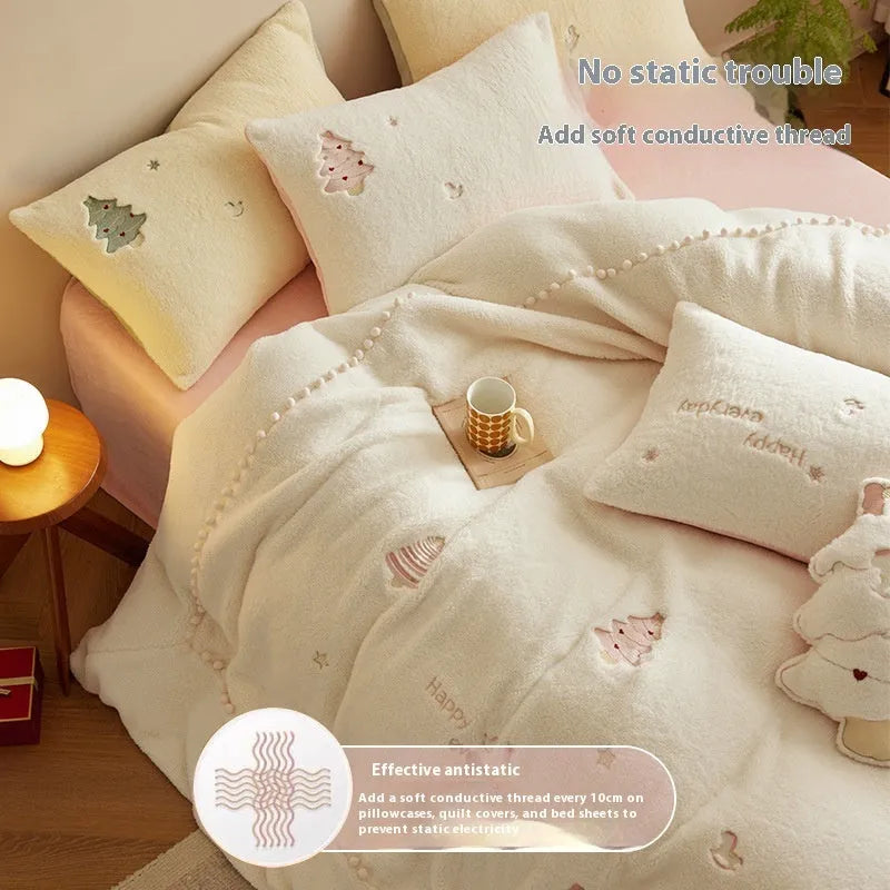 Winter milk fibre princess-style bedding four-piece set with green Christmas tree pattern on a bed.