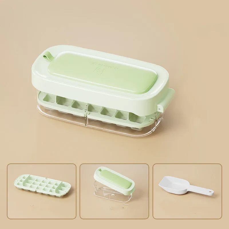 Yellow lever-action ice cube tray with high-capacity grid and attached ice shovel on a blue background.