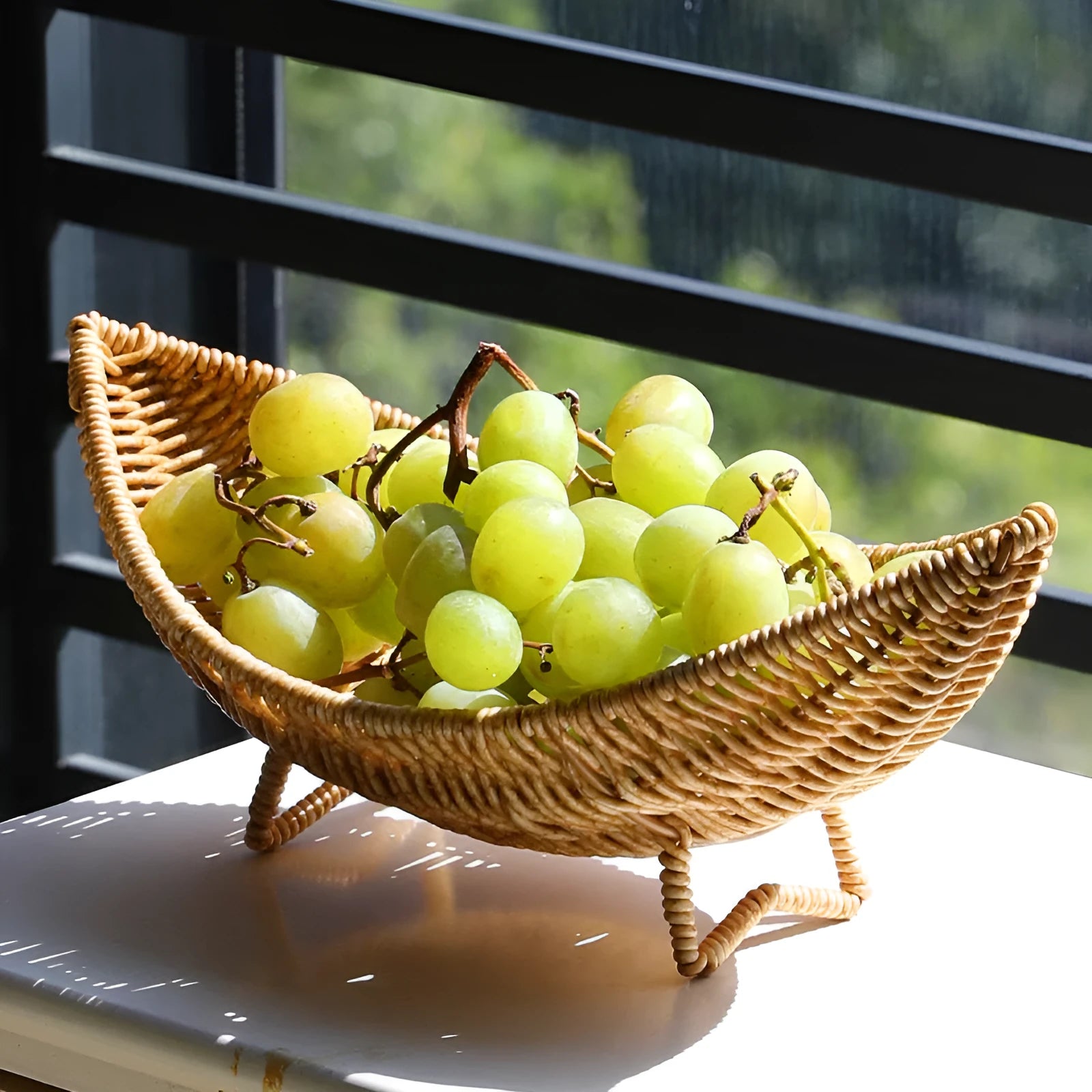 Plastic knitted basket fruit dim sum rack on a desktop with melon seeds and snacks