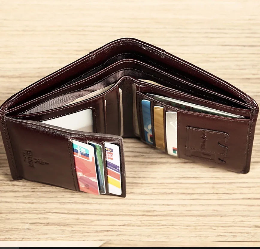 Men's black leather bi-fold wallet open to show card slots, banknote compartment, and coin pocket.