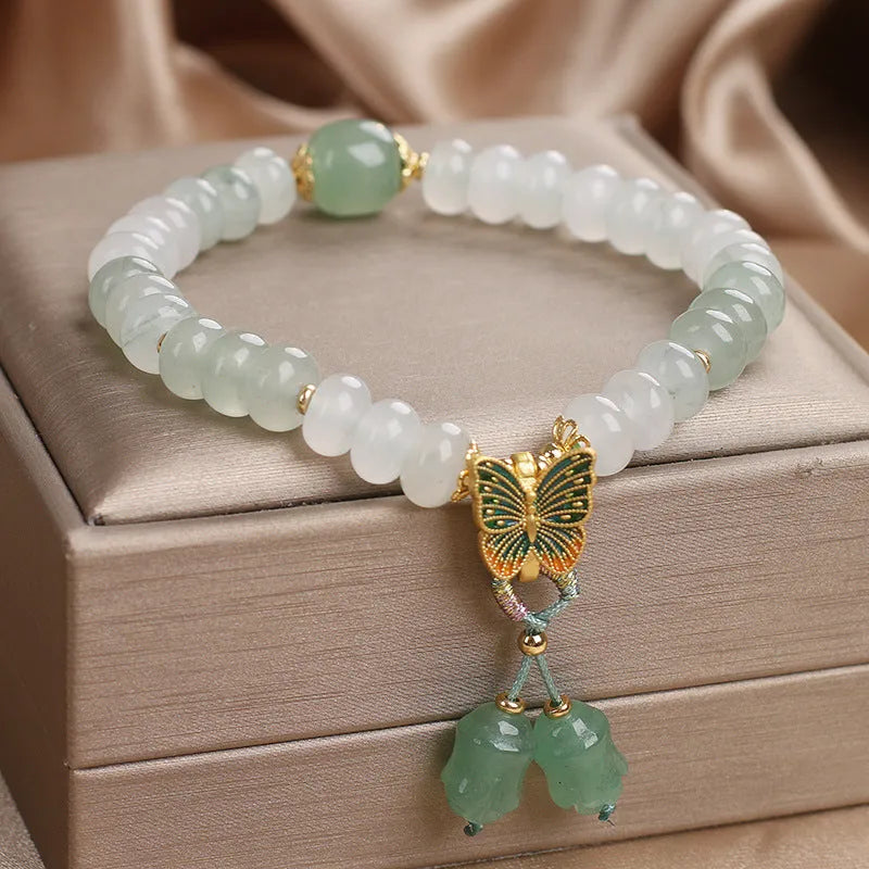 Green Tian Shan Cui abacus bead bracelet with crystal detailing and butterfly tassel