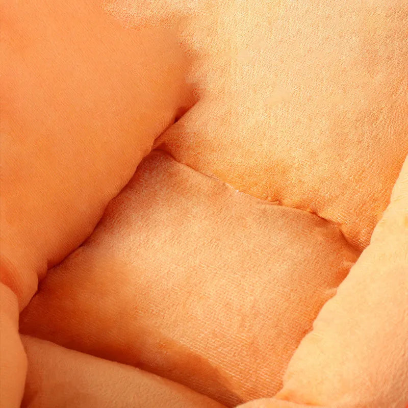 Carrot-shaped nesting dog bed with raised sides and a soft, washable blanket for small and medium pets