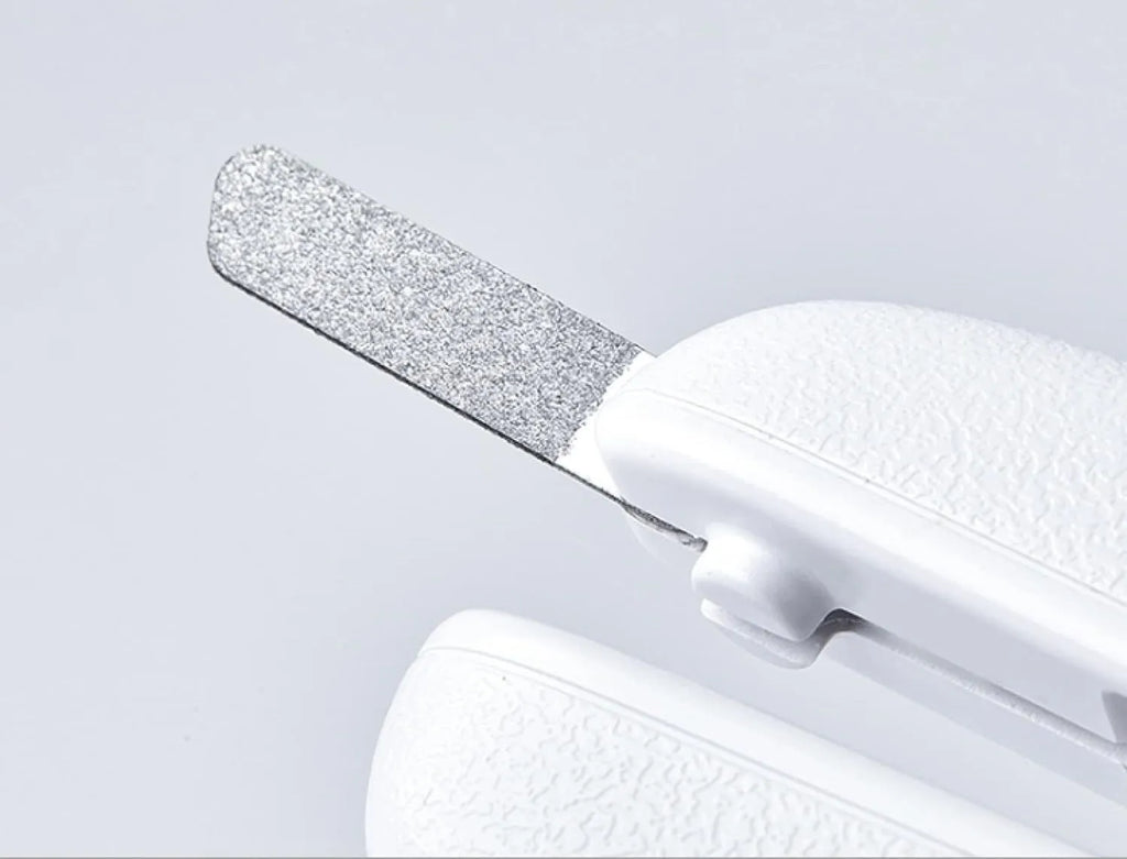 White LED pet nail clipper for cats and dogs with transparent anti-splash guard and file.